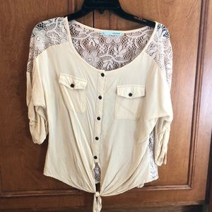 Tan shirt with lace back.